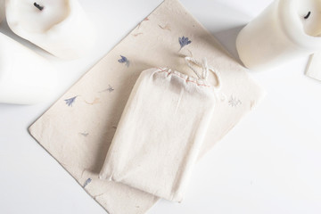 Mock up of tarot deck cotton bag and candles on white background. Boho design of tarot cards pouch...