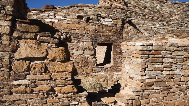 Looking through a broken out part of a wall at Chetro Ketl, Chaco Canyon in New Mexico. This is the wall of an ancient ruin built by the Anasazi people. Site was used for religious purposes. Window.