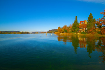Fototapeta na wymiar On Lake Constance in autumn. Near the castle Oberstaad. whose tower is about 800 years old. On the horizon begins at the Swiss town of Stein am Rhein, the Rhine River its way out of Lake Constance.