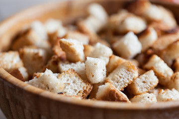 Fried rye crackers on a plate close up.