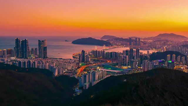Timelapse video of Busan city with twilight sky at sunset, South Korea.