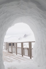 tunnel in the snow and fence 