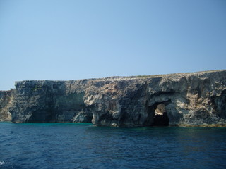 Fototapeta na wymiar Malta coastal steep area with caves