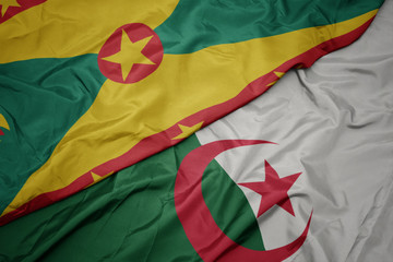 waving colorful flag of algeria and national flag of grenada.
