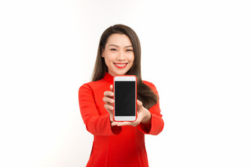 Asian woman in traditional vietnamese dress, presenting mobile screen or application for digital business and technology concept