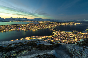 looking down to Tromsoe City at sunset