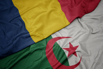 waving colorful flag of algeria and national flag of chad.