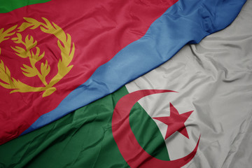 waving colorful flag of algeria and national flag of eritrea.