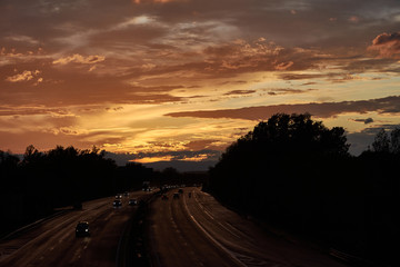 A sunset after the storm on a highway in Lyon. France