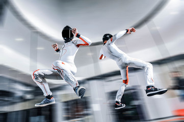Adventure fly. Indoor sky diving. Action fly sport in wind tunnel 