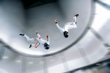 Dubai. Flying people in wind tunnel . Indoor skydiving 
