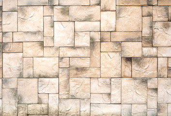 Geometric pattern of ceramic tiles of rectangular shape in different sizes.