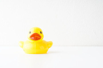 Rubber duckie day concept. Yellow rubber dack over black abd white background