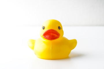 Rubber duckie day concept. Yellow rubber dack over black abd white background