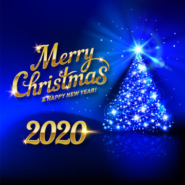 Festive Card with Bright Shining Lights of the Christmas Tree and the Inscription Golden Calligraphic Lettering Merry Christmas and Happy New Year Twenty Twenty on a Dark Blue Background