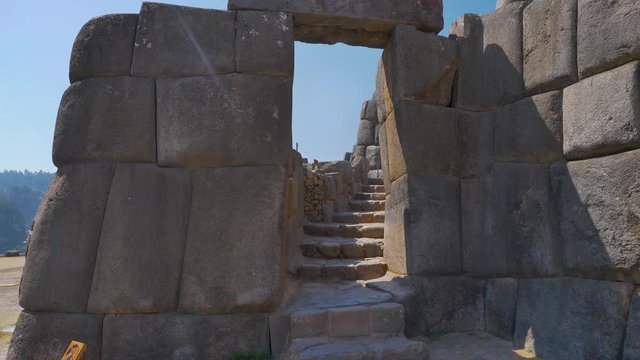 Ancient Inca gate to climb the old watchtower of the citadel of Sacsayhuaman. Fortification made base of large stone blocks carved and fit perfectly.