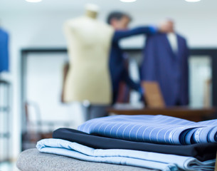 Mannequins in jacket in tailor shop and tailored suits. Concept of: tailoring, businessman, elegance.