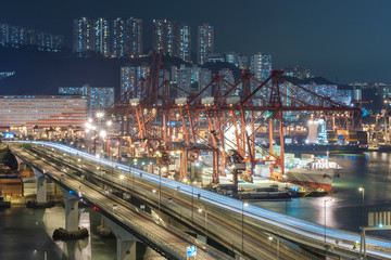 Fototapeta na wymiar cargo port and highway in Hong Kong city at night