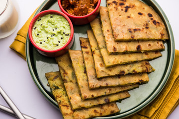 Aloo Paratha / Indian Potato stuffed Flatbread with butter on top. Served with fresh sweet Lassi,...
