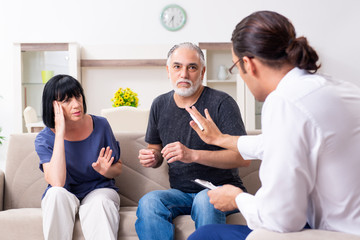 Old couple visiting psychiatrist doctor
