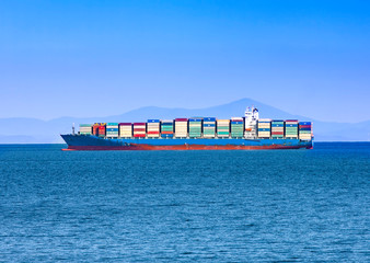 Large container ship at blue sea