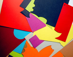 Pieces of colored paper close-up. The process of handmade greeting card creation. Colorful background, top view. 