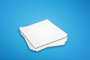 Empty note papers on blue background	