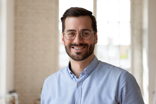 Head Shot Close Up Portrait Young Smiling Businessman.