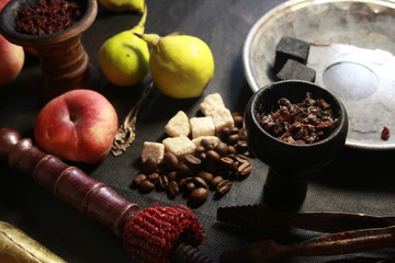 bowl with tobacco for hookah. fruits on a white background. smoking hooka