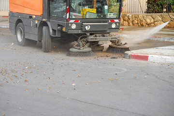 Street sweeper machine working. Street cleaning machine.       