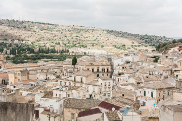 Obraz premium old italian city with small houses against blue sky