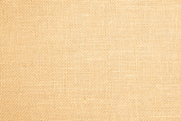 Burlap fabric patch, brown sack cloth, close up detail of natural material fabric texture for the background