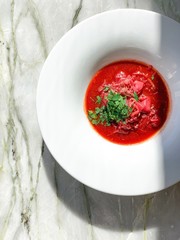 Ukrainian borsch on marble background