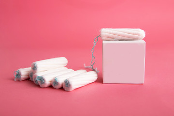 Medical female tampon on a pink background. - obrazy, fototapety, plakaty