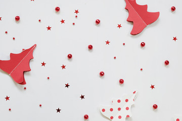Christmas background - red decorations on white table. Christmas, winter, new year concept. Flat lay, top view