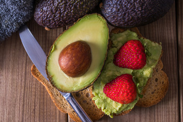 natural avocado with fruit and guacamole toast