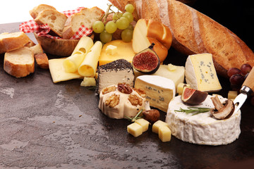 Different sorts of cheese. Cheese platter with different cheese and spice