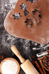 Baking christmas cookies. Typical cinnamon stars bakery with spices. xmas decoration on table