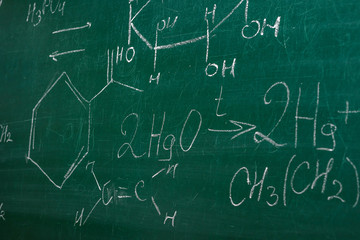 Fototapeta na wymiar Class blackboard with chemical formulas close up. Education concept