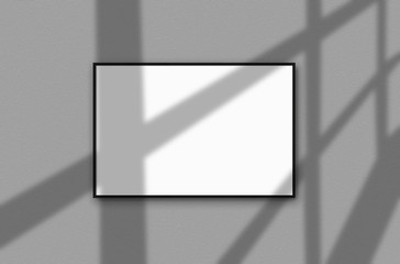 One big, white blank banner for your text or images hanging on a gray wall with shadows from the window on it. Mockup. Close-up.