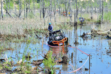 Obraz premium Summer offroad competition on ATV and UTV 