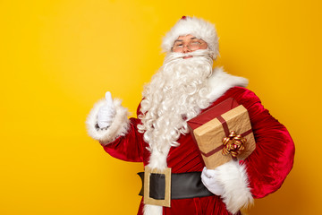 Santa Claus holding Christmas present