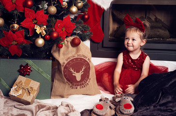 little girl with christmas presents