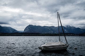 Fototapeta na wymiar boat in the lake of Switzerland alps