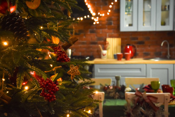 The kitchen is decorated with Christmas decorations and toys.