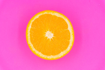 Organic freshness Orange fruit cutting taste sweet and sour on isolate pink pastel background