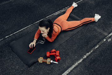 Portrait of One Sports Fitness Girl Dressed Fashion Sportswear Outfit Doing Exercise and Training at the City Stadium, Healthy Lifestyle Concept