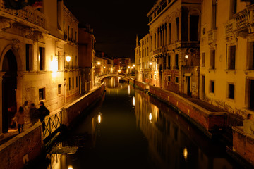 Bridge over canal in venice at night