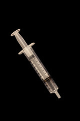 10ml syringe on black background