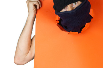 man with balaclava with his head coming out of a red cardboard on White background